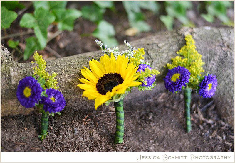 Sunflower boutonniere with purple flower